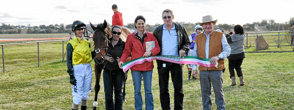 CELEBRATION TIME: Killarney Cup winning connections (from left) Storm Magic jockey Amy Van Der Sanden, strapper Simone Pitman and trainer Jackie Crompton with Warwick Turf Club committee member David Wyvill and Killarney Hotel Motel representative Les Clarke. CELEBRATION TIME: Killarney Cup winning connections (from left) Storm Magic jockey Amy Van Der Sanden, strapper Simone Pitman and trainer Jackie Crompton with Warwick Turf Club committee member David Wyvill and Killarney Hotel Motel representative Les Clarke.